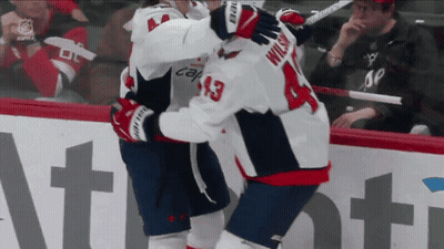 Hockey Player Wilson 13 Hugging Another Player GIF