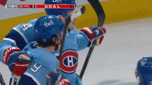 Hockey Player With Bell Helmet Hugging Another Player GIF