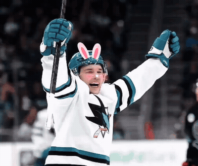 Hockey Player With Bunny Ears Holding Puck GIF