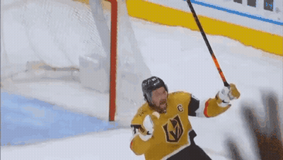 Hockey Player With C Holding Hockey Stick GIF