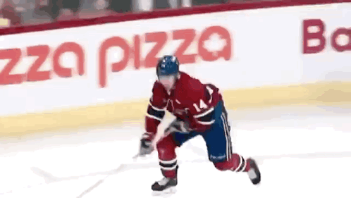 Hockey Player With Number 14 Skating On Ice GIF