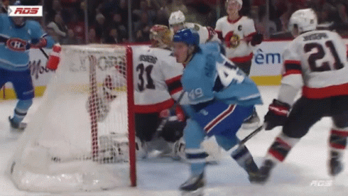 Hockey Player With Number 21 Playing Defense GIF