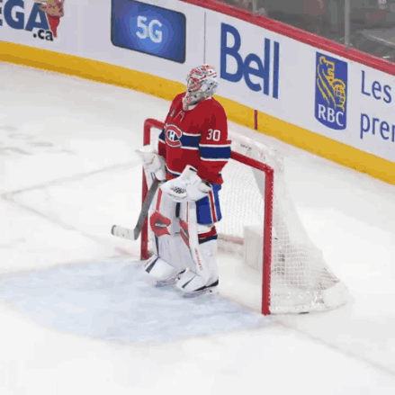 Hockey Player With Number 30 Standing In Front Of Net GIF