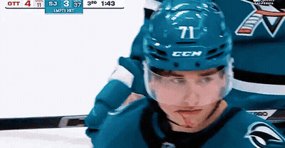 Hockey Player With Number 71 Helmet Looking At Camera GIF