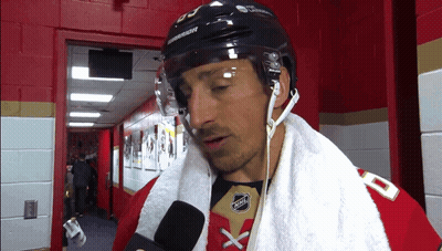 Hockey Player With Towel And Warrior Helmet GIF