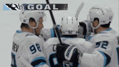 Hockey Players Celebrating Goal With Banner GIF