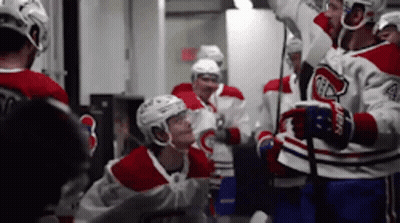 Hockey Players Huddled In Locker Room GIF