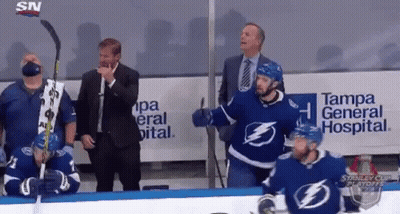 Hockey Players In Locker Room With Stick GIF