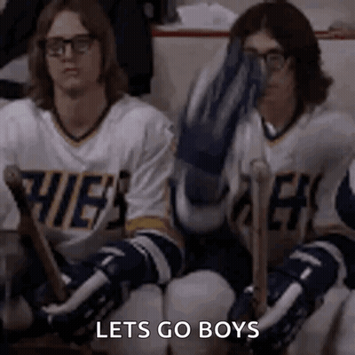Hockey Players On Bench One Covering Face GIF
