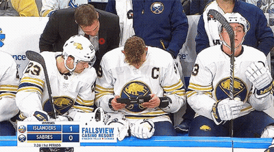 Hockey Players On Bench With Fallsview Casino Resort Sign GIF