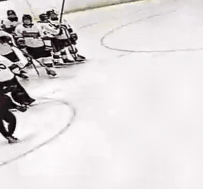 Hockey Players On Ice, One With Number 20 GIF