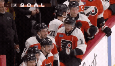 Hockey Players On Ice With Number 71 GIF