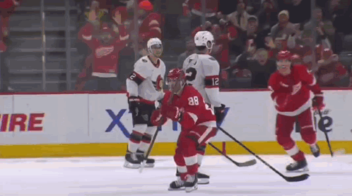 Hockey Players Playing On Ice GIF