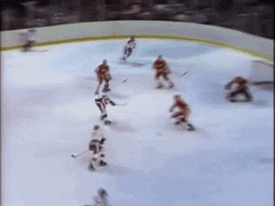 Hockey Players Playing On Ice Rink GIF