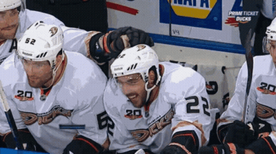 Hockey Players Sitting In Locker Room GIF