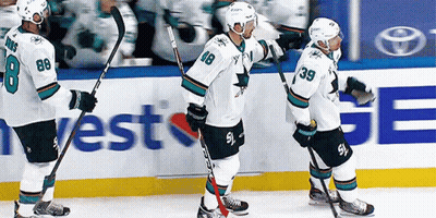 Hockey Players Standing On Ice With West Ge Ad GIF