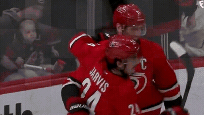 Hockey Players Standing On Rink GIF