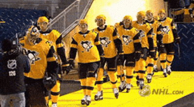 Hockey Players Walking Down Yellow Carpet With NHL.com GIF