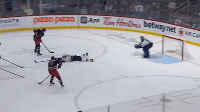 Hockey Rink With Tim Hortons And Pezzo Pizza Ads GIF