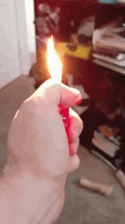 Holding A Lighted Lighter GIF
