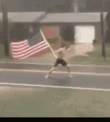 Holding American Flag Outside Hurricane Meme GIF