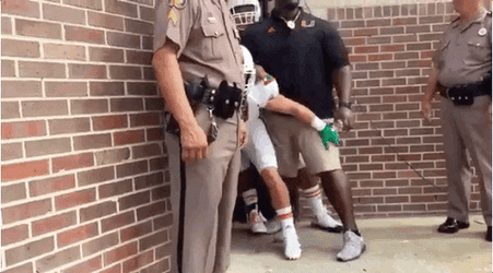 Holding Back Rushing Players GIF