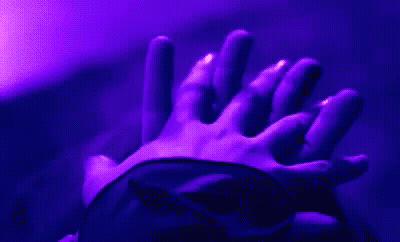 Holding Hands In Dark Room With Purple Light GIF
