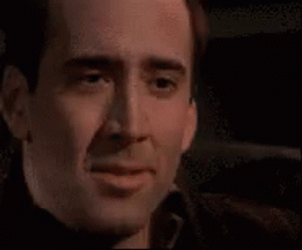Holding In Laugh Nicolas Cage GIF