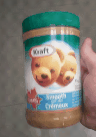 Holding Kraft Smooth Creameux Peanut Butter GIF
