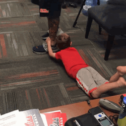 Holding On Leg Against The Wall GIF