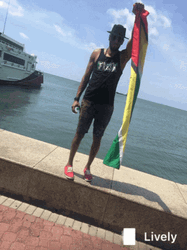 Holding The Flag Of Guyana GIF