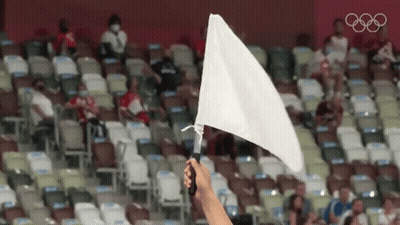 Holding White Flag In Stadium With Olympic Rings GIF