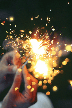 Holding Yellow Sparklers GIF
