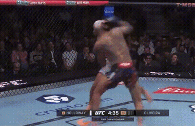 Holloway And Oliveira Fighting In UFC Ring GIF