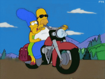 Homer Simpson And Marge Simpson Are Riding A Motorcycle Together GIF