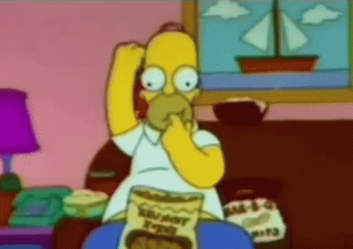 Homer Simpson From The Simpsons Is Eating A Bag Of Crunchy Potato Chips GIF