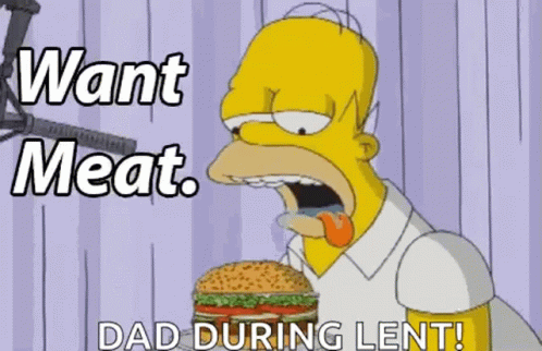 Homer Simpson From The Simpsons Is Eating A Hamburger With His Tongue Out . GIF