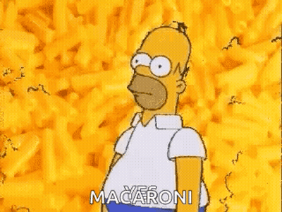 Homer Simpson From The Simpsons Is Standing In Front Of A Pile Of Macaroni . GIF