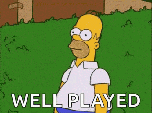 Homer Simpson From The Simpsons Is Standing In The Grass With The Words `` Well Played '' . GIF