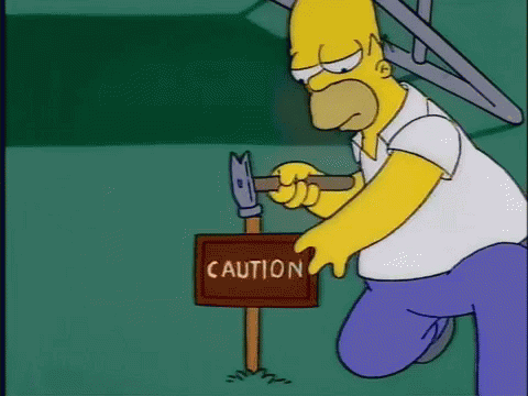 Homer Simpson Holding Hammer Next To Caution Sign GIF