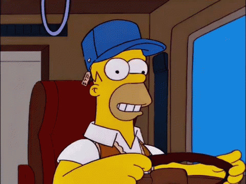Homer Simpson In Blue Hat Holding Steering Wheel GIF