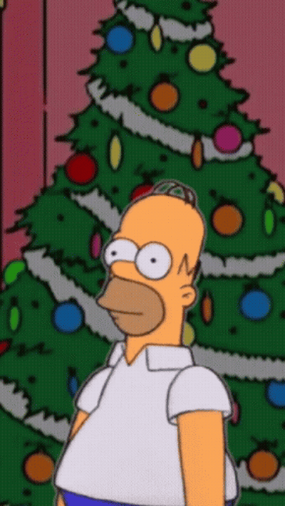 Homer Simpson In Front Of Christmas Tree With Decorations GIF