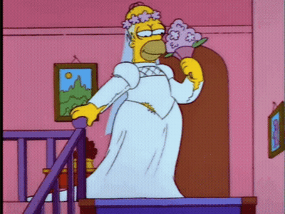 Homer Simpson In Wedding Dress Holding Flowers GIF
