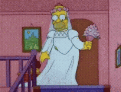 Homer Simpson Is Dressed As A Bride And Is Holding A Bouquet Of Flowers . GIF