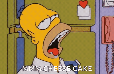 Homer Simpson Is Eating A Cheese Cake In A Cartoon . GIF