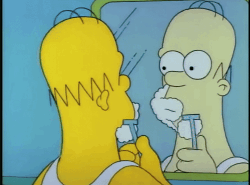Homer Simpson Is Looking At His Reflection In The Mirror GIF