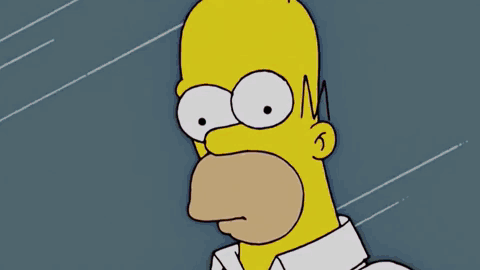 Homer Simpson Is Pointing At A Machine That Has The Word Product On It GIF