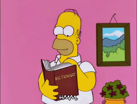 Homer Simpson Is Reading A Dictionary In Front Of A Picture GIF