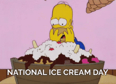 Homer Simpson Is Sitting In A Bucket Of Ice Cream With The Words National Ice Cream Day Below Him . GIF