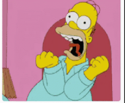 Homer Simpson Is Sitting In A Chair With His Mouth Wide Open GIF